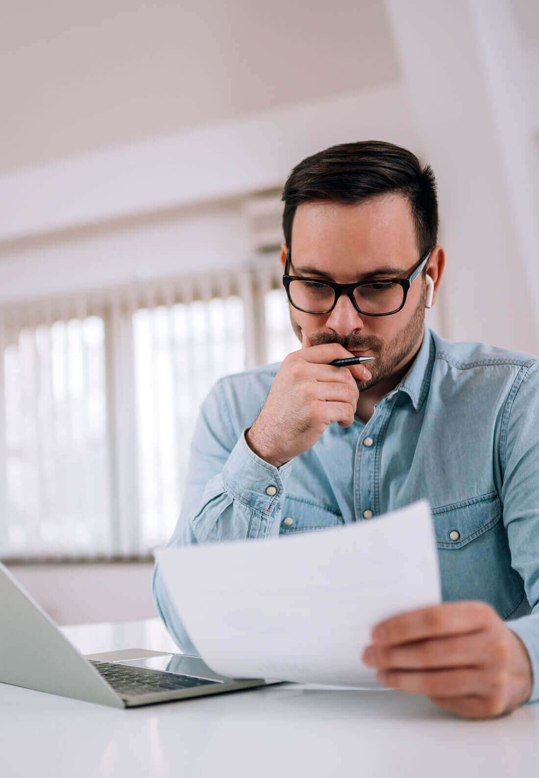 Serious Man Looking At Paper Document, Portrait.